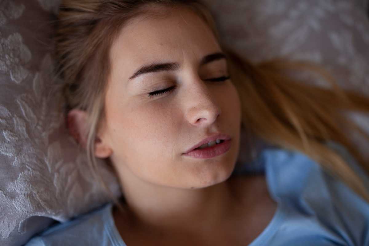 woman grinding teeth while sleeping