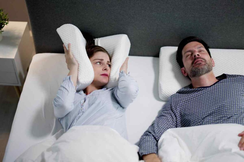 woman can not sleep because of husband snooring