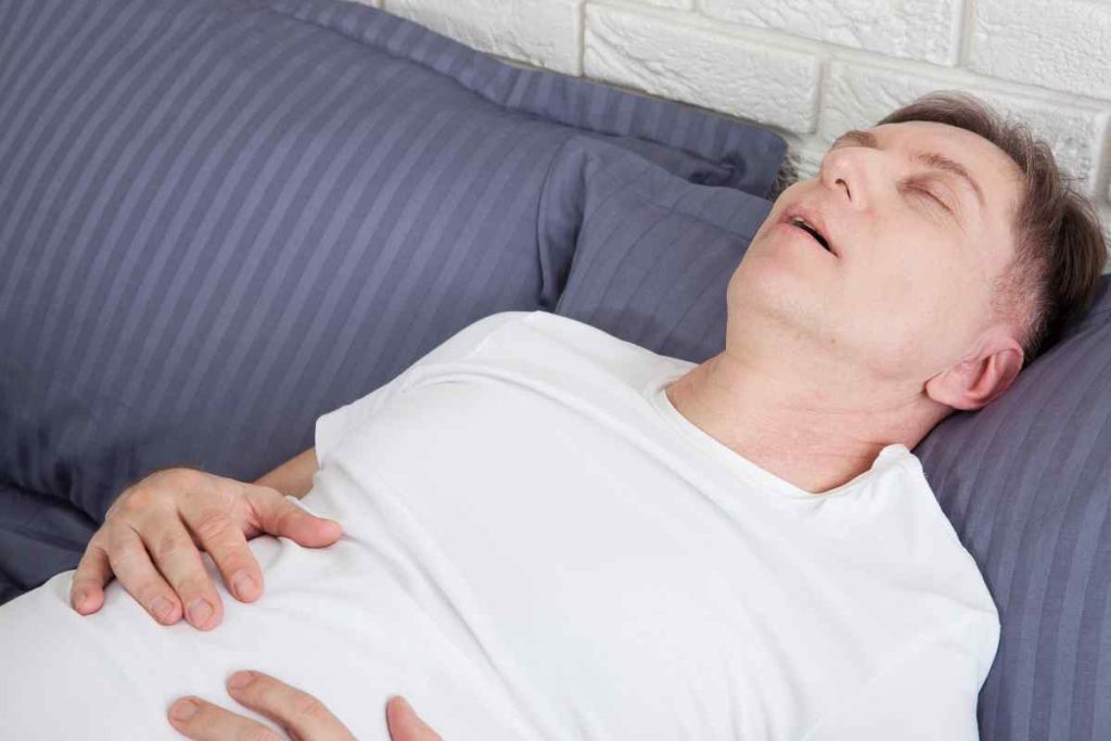 a man sleeping withour sleep apnea device