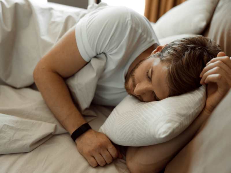 A man Sleeping and diagnosing sleep apnea