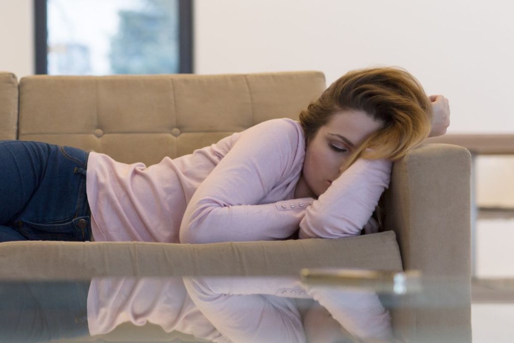 My sister comfortably sleeping on the couch after using Tryptophan sleep aid.