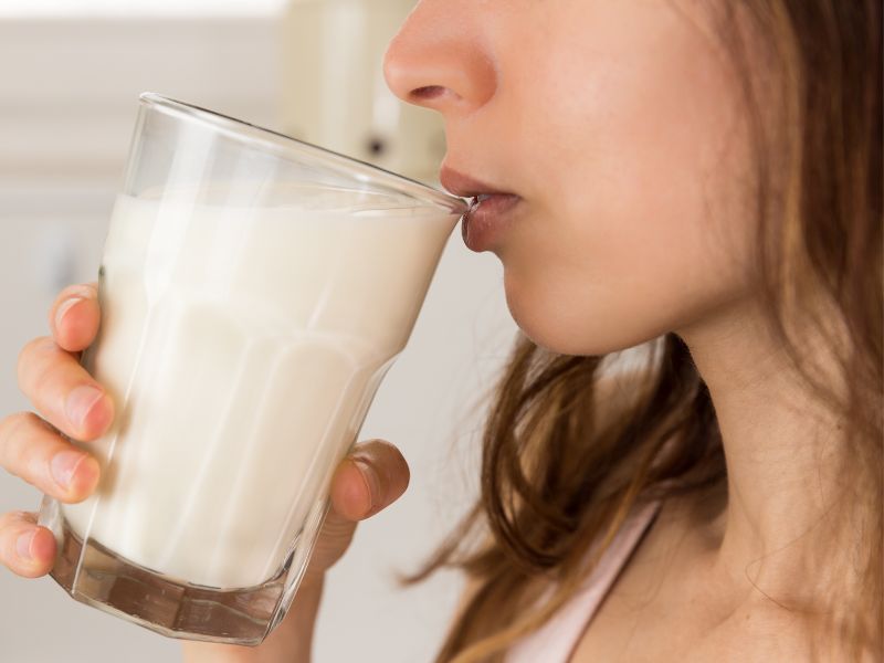 My sister drinking a warm glass of milk before bed as a natural sleep aid