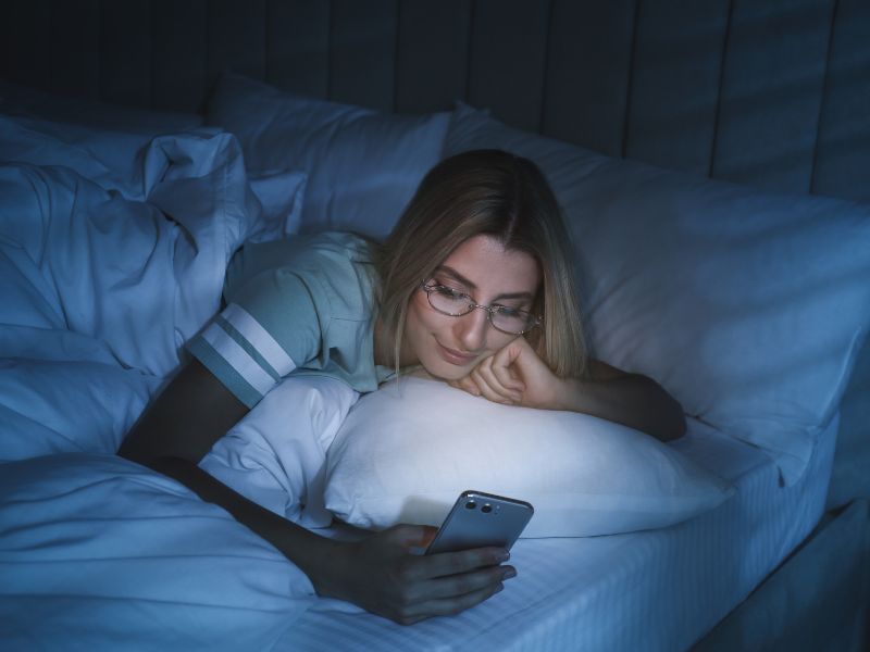 Lady using a kindle to help with her sleep disorder