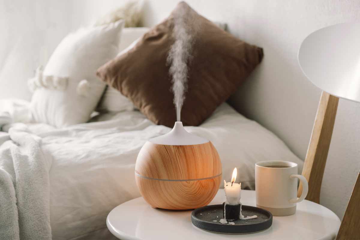 electric aromatherapy diffuser on the bed side table